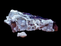 Calcite on limestone, fluoresces white longwave and shortwave, strong phosphorescence, Hampshire County, Near Romney, West Virginia (longwave, midrange, shortwave UV)